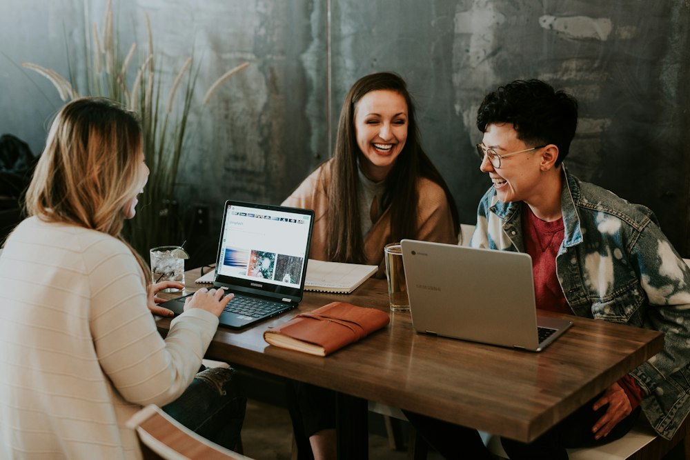 Joyful high-five between participant and mentor celebrating daily achievement