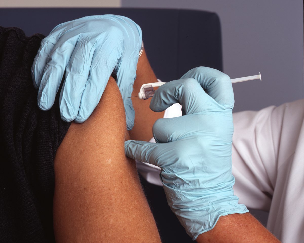 Healthcare professional providing gentle care and routine wellness monitoring